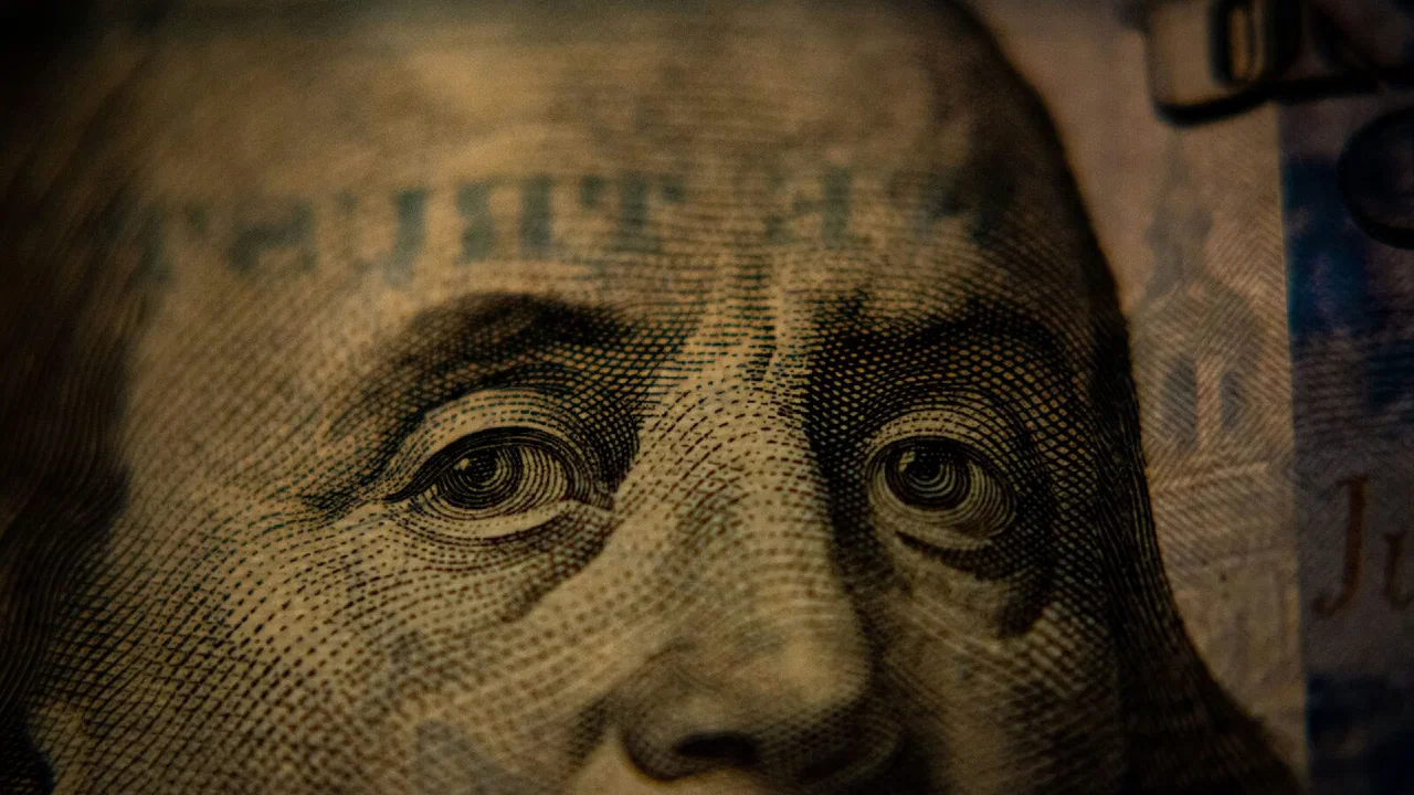 A close-up of Benjamin Franklin on a United States one hundred dollar bill