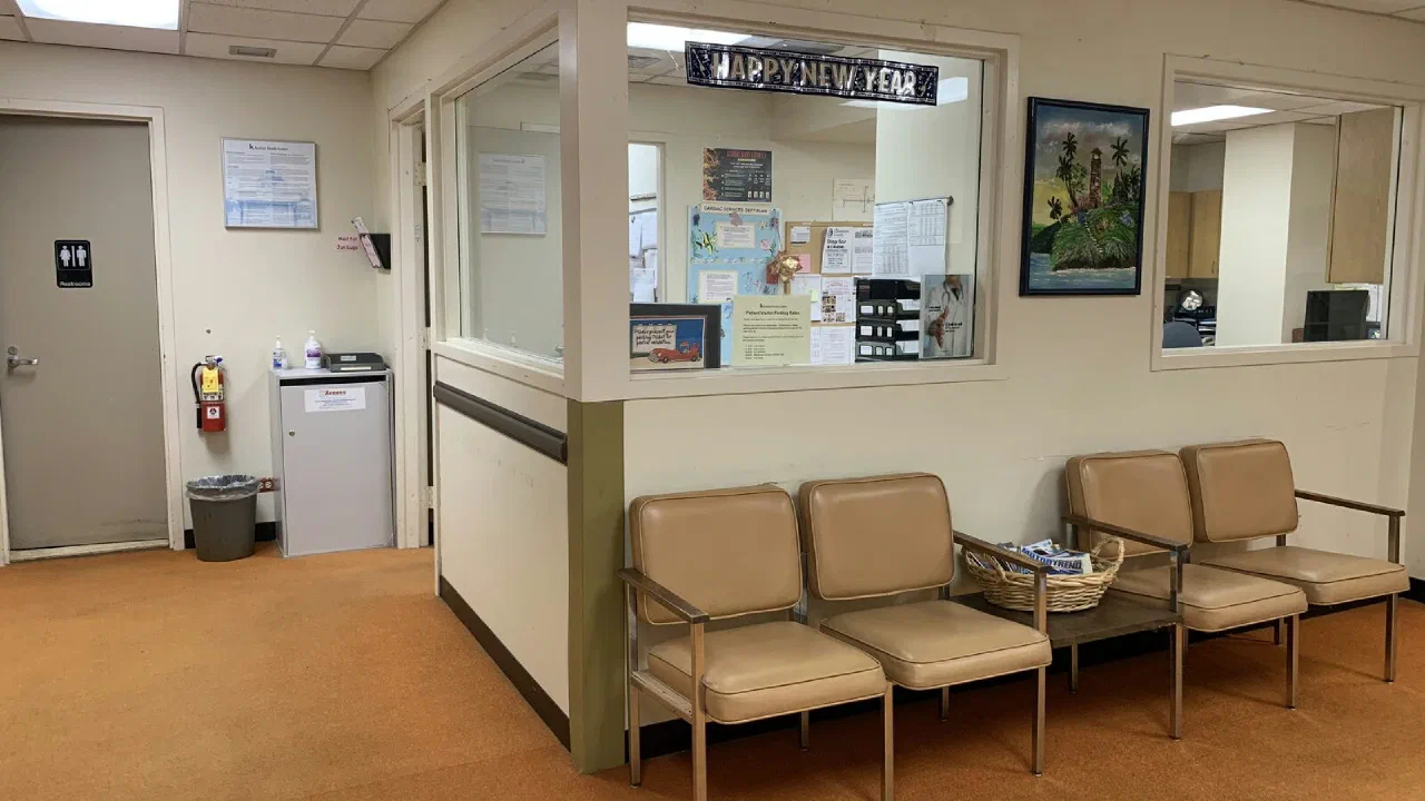 Empty padded armchairs in a doctor's waiting room